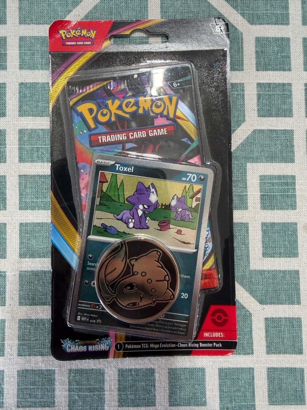 Pokémon TCG Mega Evolution—Chaos Rising  Blister Pack Toxel Promo Card and Coin